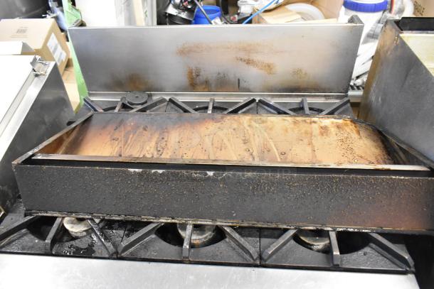 Southbend P36G-BBB stainless steel 6 burner range with oven, used, showing wear and discoloration on surface.