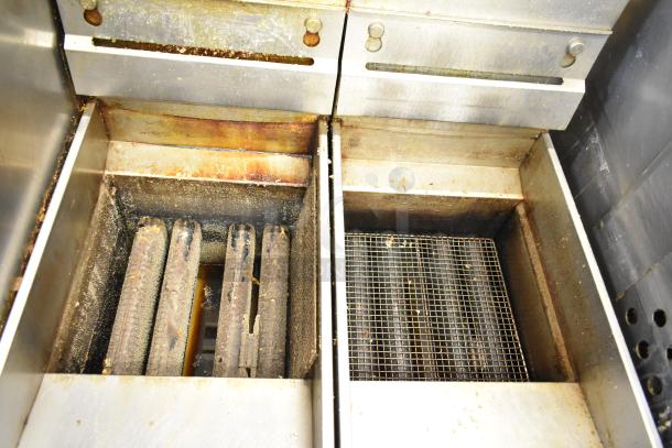 2 Pitco Frialator stainless steel commercial floor deep fat fryers, showing heating elements; signs of use visible.