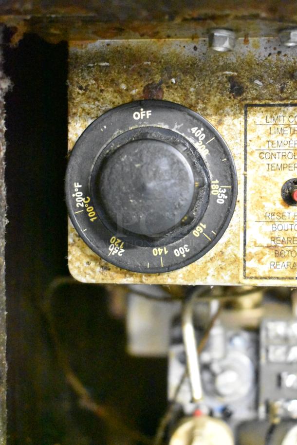Pitco Frialator deep fat fryer control panel, showing a temperature dial with markings from 100°C to 200°F. Slightly worn condition.