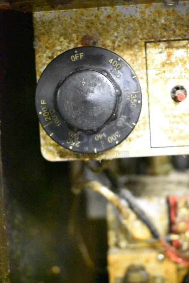 Pitco Frialator fryer control panel showing a temperature dial ranging from 200°F to 400°F, visibly worn and soiled.