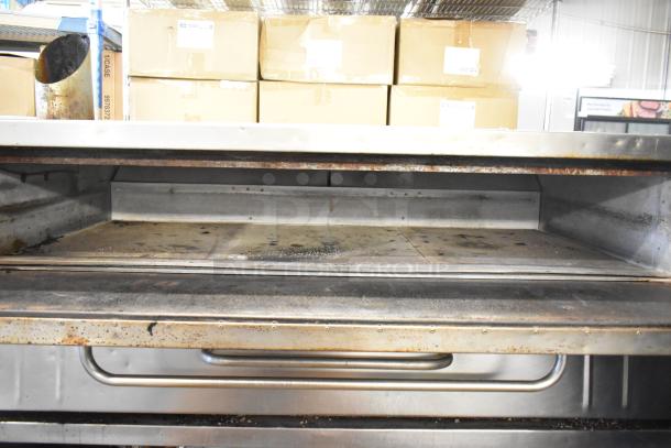 Bakers Pride 4151 stainless steel commercial pizza oven, natural gas, single deck, on legs, 70,000 BTU, used condition.