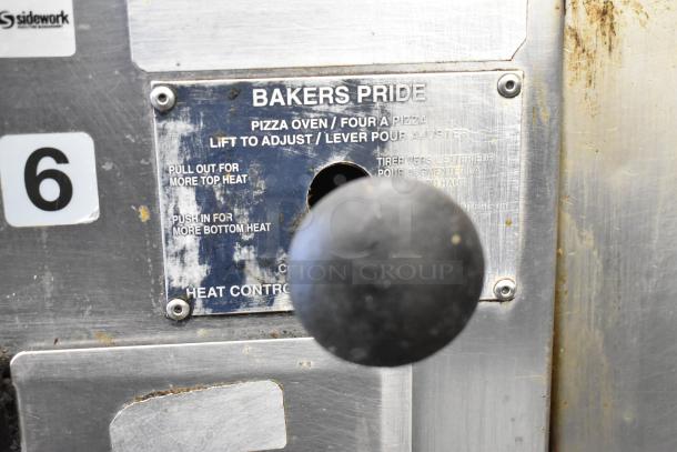 Bakers Pride 4151 stainless steel pizza oven heat control panel with lever. Visible wear on panel markings.
