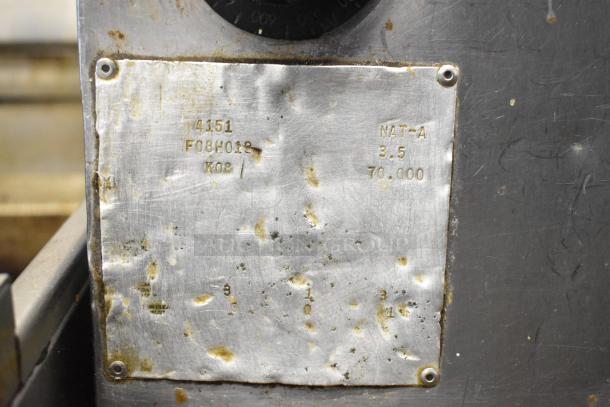 Bakers Pride 4151 stainless steel pizza oven label, showing model and 70,000 BTU. Marks indicate natural gas use.