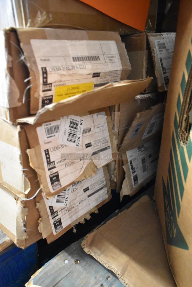 Boxes of various items including light fixtures, visible labels, and shipping tags indicate contents and shipping details.