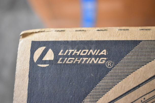 Cardboard box corner with Lithonia Lighting logo, potentially containing I Beam LED light fixtures.