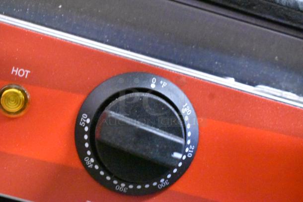 Close-up of Avantco 177PG400S panini grill control knob, showing temperature settings from 120°F to 570°F. Unit is new with minor scratches.