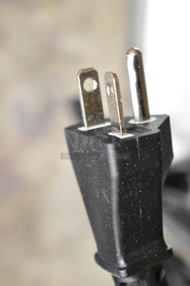 Close-up of three-prong plug from Avantco 177IWC35 stainless steel commercial induction range. 208-240 Volts, 1 Phase. New.