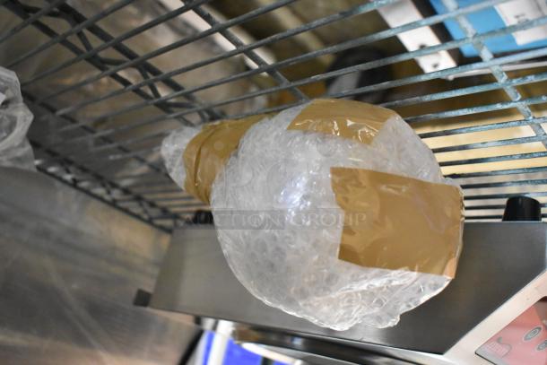 Brand new Hanson 400-RET-BK heat lamp with retractable cord, black finish, some scratches and dents, 120V, ceiling mount.