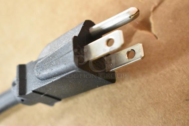 Close-up of the plug for a Cadco PCG-10C countertop griddle, showing standard three-prong design.