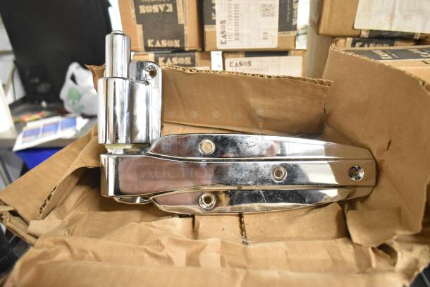 6 new Kason items, including a door hinge and release handle, in original packaging. Visible brand markings, slight scratches.