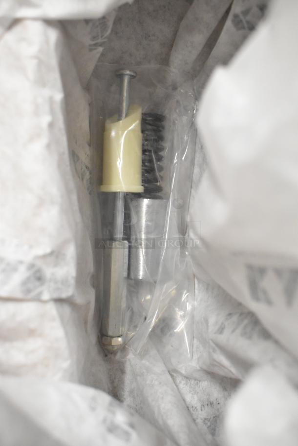 6 brand new Kason items, including caulk, door handle, hex foot insert. Scratch and dent condition, sealed in packaging.