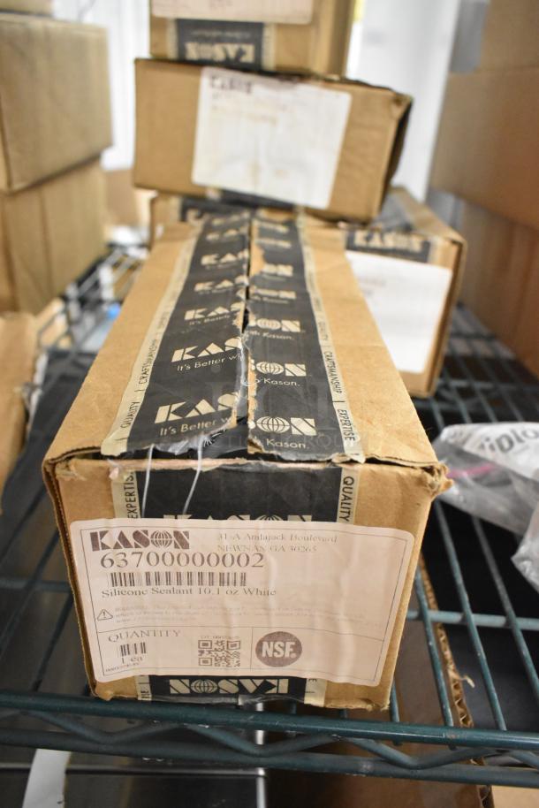 New Kason items in box, including caulk, door handle, hex foot insert. Box labeled with Kason branding and barcode.