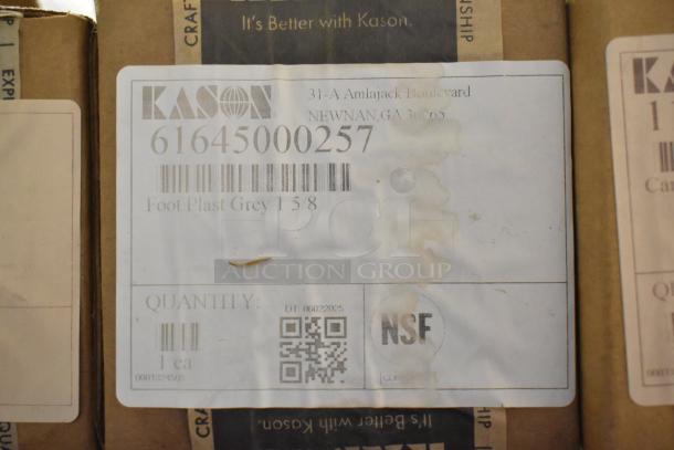 Box labeled Kason, model 61645000257, Foot Plast Grey 1 5/8, NSF certified. New, shows signs of minor dents.