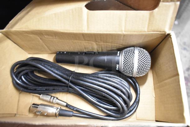 Cardboard box containing a PYLE microphone with cable. Includes a metal can opener. Items appear in good condition.