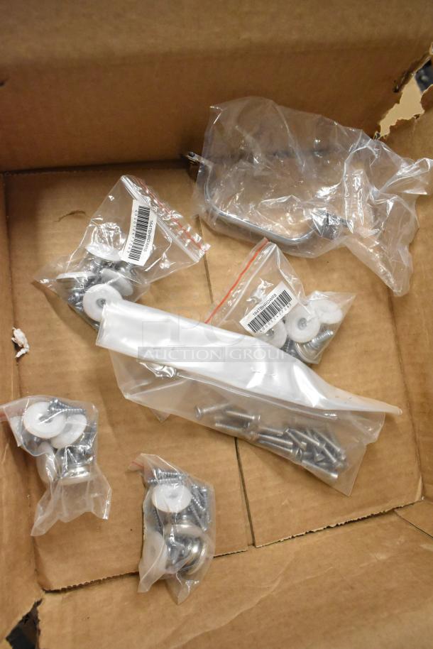 Box with assorted items, including sealed bags of screws and washers. Features a metal can opener and microphone. New condition.