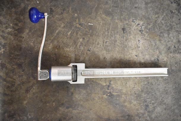 Metal can opener by Edlund Co., Burlington, VT, USA. Features a blue handle and a sturdy design, in good condition.