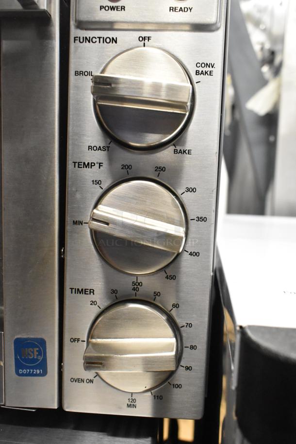Waring WCO250X stainless steel convection oven control panel with temperature, function, and timer dials; NSF certified.