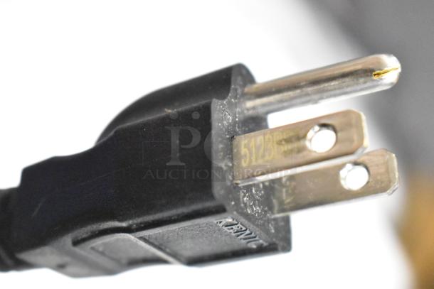 Close-up of a power plug for the 2023 Waring WCO250X convection oven. Plug shows model number 5123S engraved.