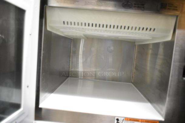 Brand new 2025 Amana RC22S2 heavy-duty stainless steel commercial microwave oven interior. Scratch and dent model.