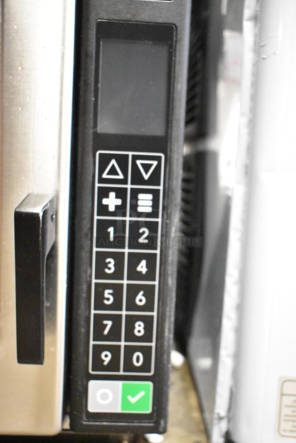 Brand new 2025 Amana RC22S2 stainless steel commercial microwave, push button controls, 208/240 volts, minor scratches.