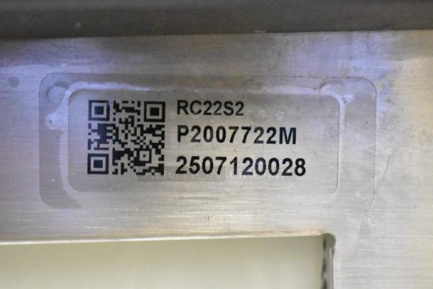 QR code and label on Amana RC22S2 commercial microwave indicate model, serial numbers, and manufacturing specifics.
