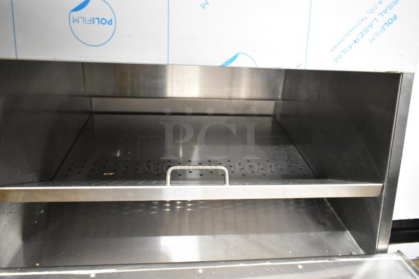 ServIt 423TCW46 46-gallon stainless steel chip warmer, new, minor dents, 120V, First-In First-Out design, interior view.