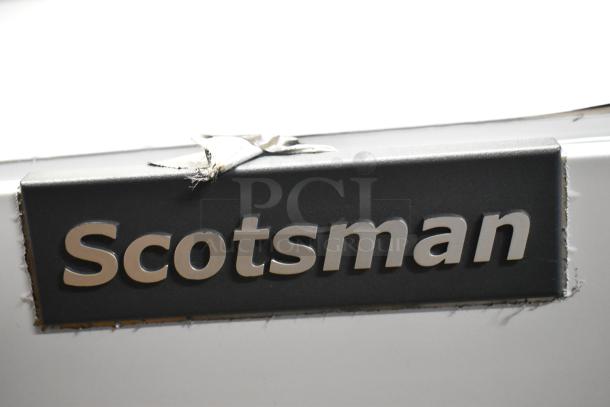 Brand new Scotsman MC0530MAX-1A ice machine logo detail. Features slight scratch, stainless steel, medium cube, 476 lb capacity.