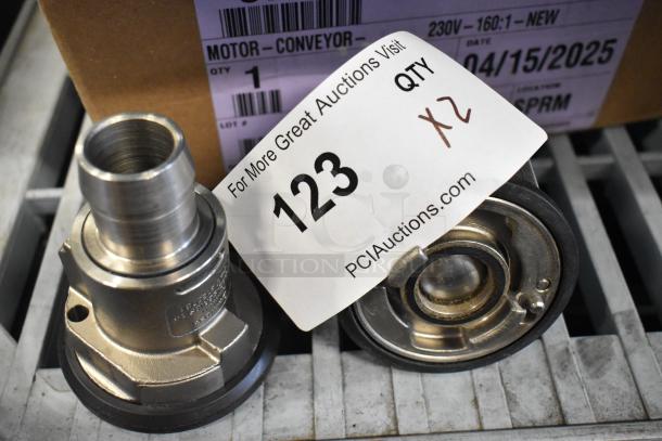 Brand new metal units with slight scratches and dents, auction tag reads '123, Qty 2', bid multiplier noted.