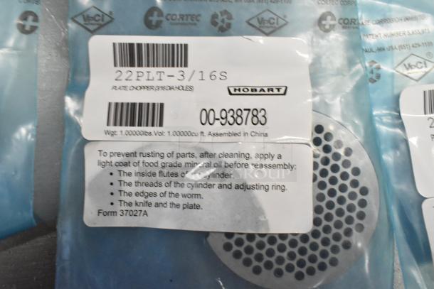 7 new Hobart grinder plates, 22PLT-3/16S model, in sealed packaging. Includes instructions for rust prevention.