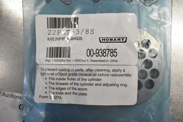 Hobart grinder plate 22PLT-3/8S for meat chopper, new condition. Includes usage instructions and assembly details on label.