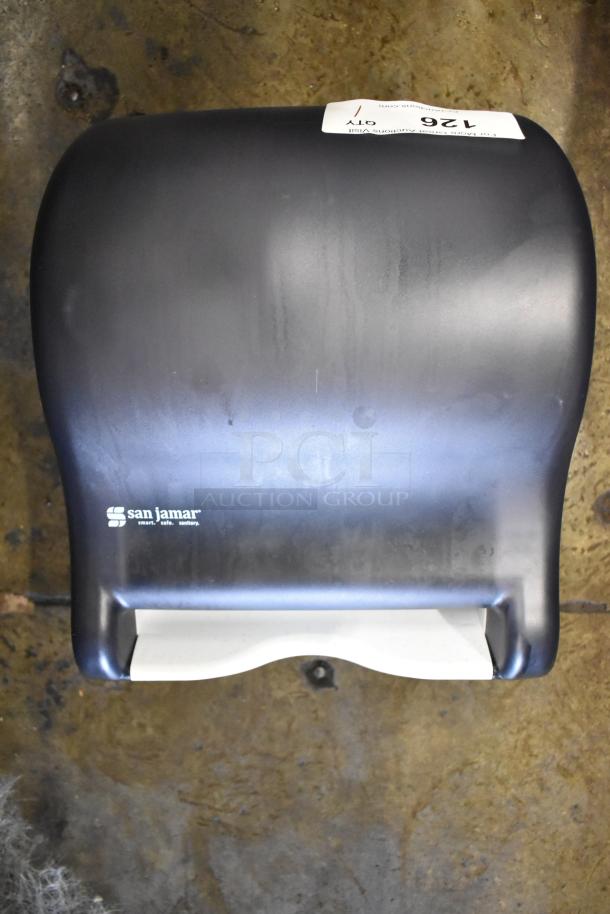 BRAND NEW San Jamar Poly Wall Mount Paper Towel Dispenser with minor scratches and dents; model marked on unit.