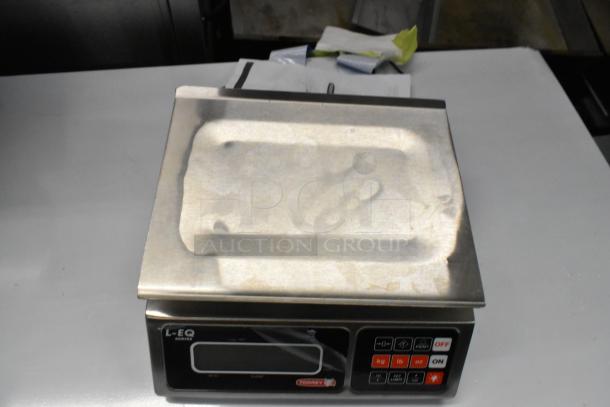 Brand new Torrey L-EQ-5/10, 10 lb. digital portion control scale, model 166LEQ510. Visible scratches and dents.
