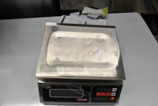 Brand new Torrey L-EQ-5/10, 10 lb. digital portion control scale, model 166LEQ510. Visible scratches and dents.