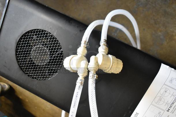 BRAND NEW SCRATCH AND DENT! Fetco DRNX by BROOD DUO Nitro Cold Brew Dispenser, showing hoses and fan vent. Model DRNX SLM DUO.