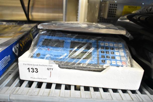 AvaWeigh 334PCS15 15 lb. digital price computing scale, brand new with minor scratches, in packaging with display and keypad visible.