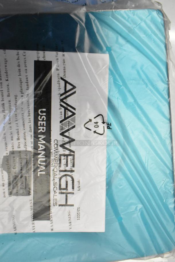 Brand new AvaWeigh 334PCS15 Digital Price Computing Scale, 15 lb capacity, in packaging. Includes user manual. Scratch and dent condition.