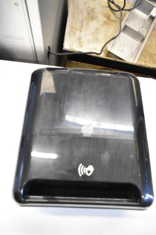 Black Tork Matic® 5511284 automatic hand towel dispenser, new with scratches, wall-mount design, model 7125511284.