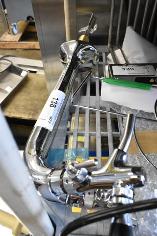 Brand new stainless steel beer tower with two taps, scratch and dent condition, labeled item 138.