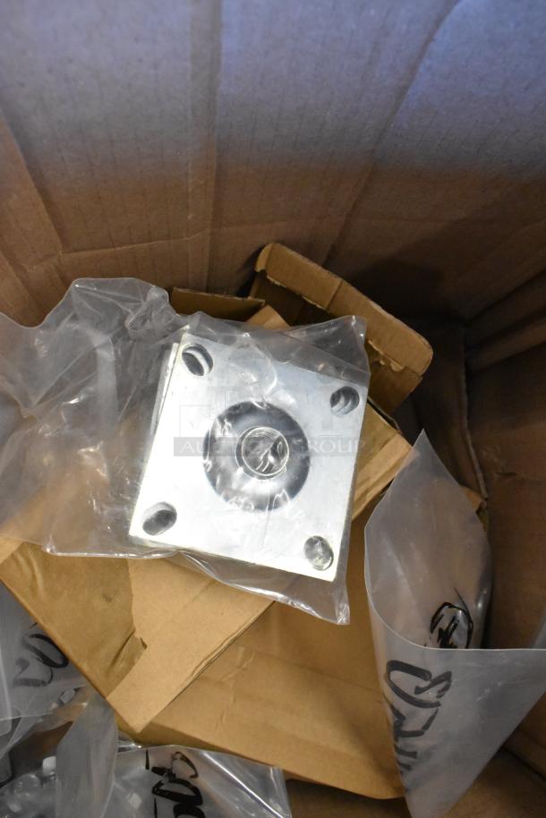 Lot of brand new legs, screws, and washers in a box, some items in plastic. Minor scratches and dents visible.