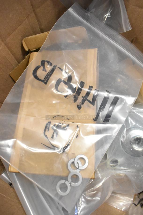 Lot of legs, screws, and washers in clear plastic bags. Brand new, scratch and dent condition. Marked with "H4H3".