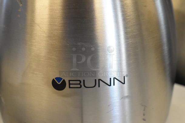 Bunn stainless steel coffee pot with logo, minor scratches indicating scratch and dent condition.