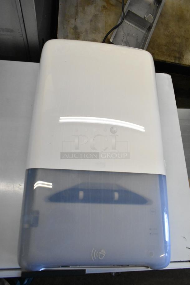 Tork PeakServe 552540 White Automatic Continuous Paper Towel Dispenser, new, scratch and dent condition, front view.