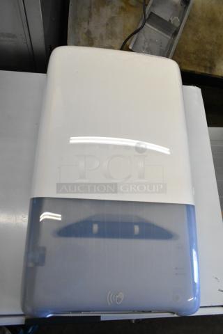 Tork PeakServe 552540 White Automatic Continuous Paper Towel Dispenser, new, scratch and dent condition, front view.