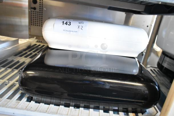 Tork PeakServe 552540 white and 552548 black automatic paper towel dispensers. New with visible label "143 QTY x2".