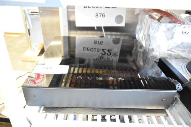 Brand new Avantco 177ICW300 black countertop induction warmer, 16"x16". Scratch and dent condition. 120V, 1 phase. Control panel visible.