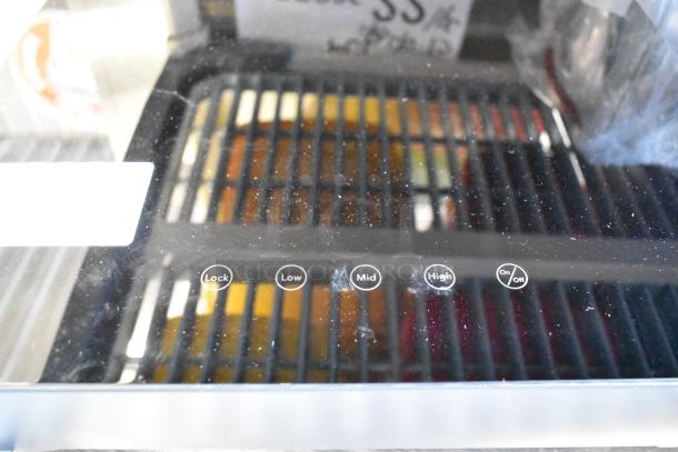 Avantco 177ICW300 black countertop induction warmer, 16"x16", 120 volts, 1 phase, new with minor scratches, control panel visible.