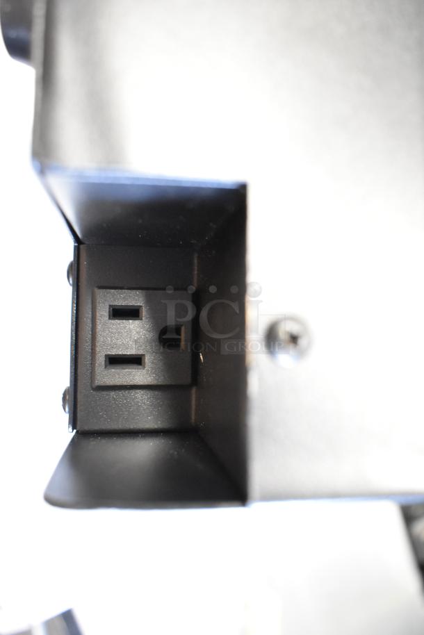 Close-up view of the power socket on an Avantco 177ICW300 induction warmer. Black finish, pristine condition.