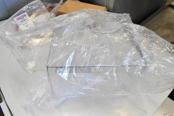 5 BRAND NEW Scratch and Dent items including Bunn Hopper, Faucet Kit, Blodgett Door Guide with visible labels.