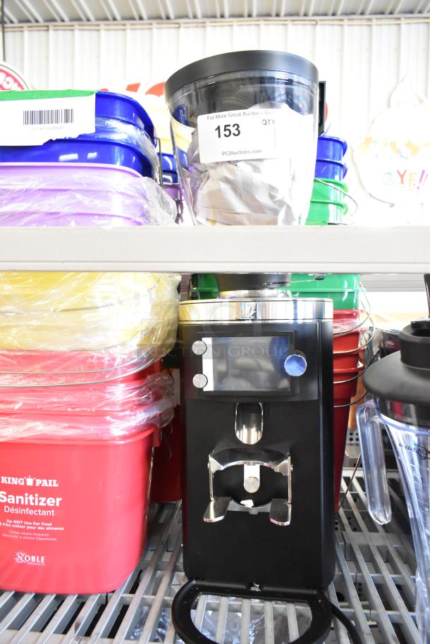 BRAND NEW 2025 Mahlkonig E65T GBS black metal commercial espresso grinder, 2.6 lb capacity, 120V, tagged "153".