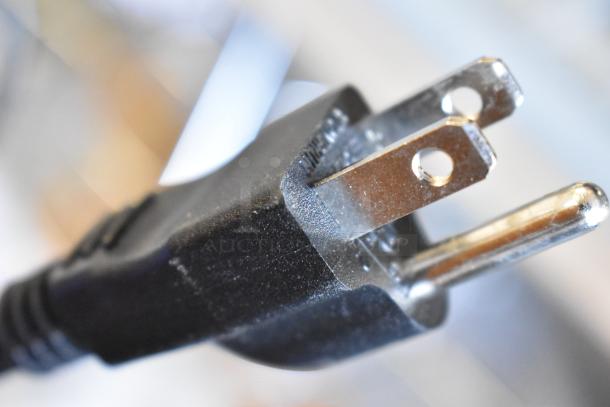 Close-up image of a 120V power plug for a Mahlkonig E65T espresso grinder.